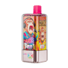 A compact vape pod with a bright pink mouthpiece and a metallic pink base, wrapped in a vibrant graphic showing a lion and a monkey wearing headphones and speaking into a microphone, with flavor labels like Blueberry Raspberry and Mixed Berry.