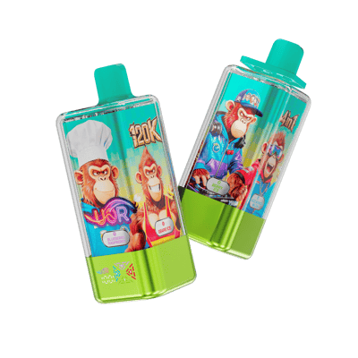 Two fruit-flavored juice pouches with turquoise caps, angled diagonally, featuring bright cartoon monkey characters on turquoise labels with green bottoms against a black background.