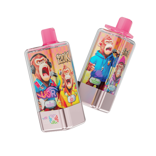 Two disposable vape devices with pink tops and silver bases lean at an angle against a black background, featuring bright cartoon monkey artwork and multicolored branding.